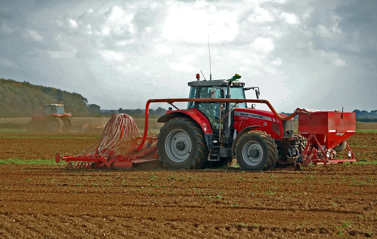 Tractor pulling seeding and tillage equipment