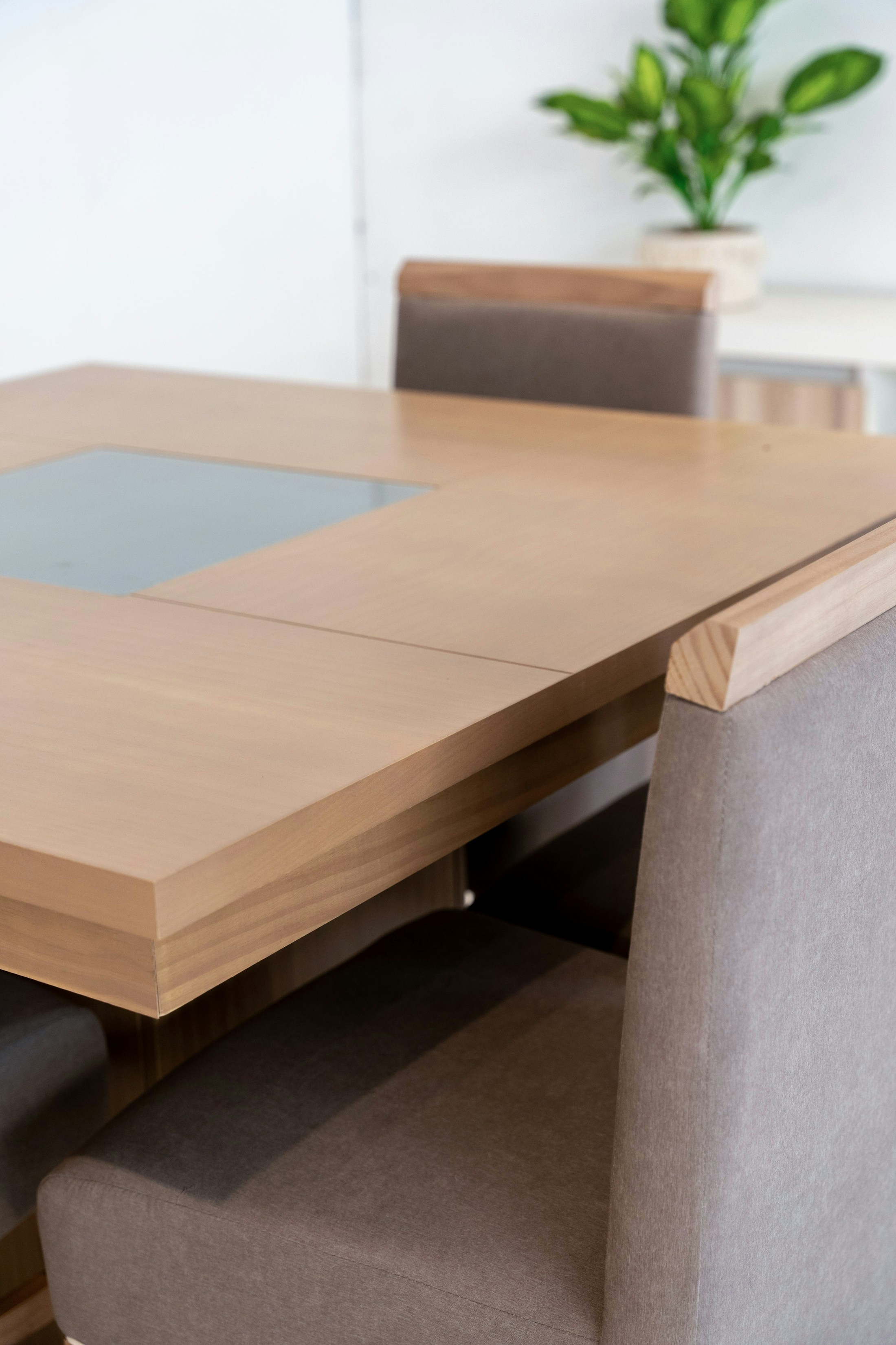 Warm modern dining room with a wooden table and upholstered chairs